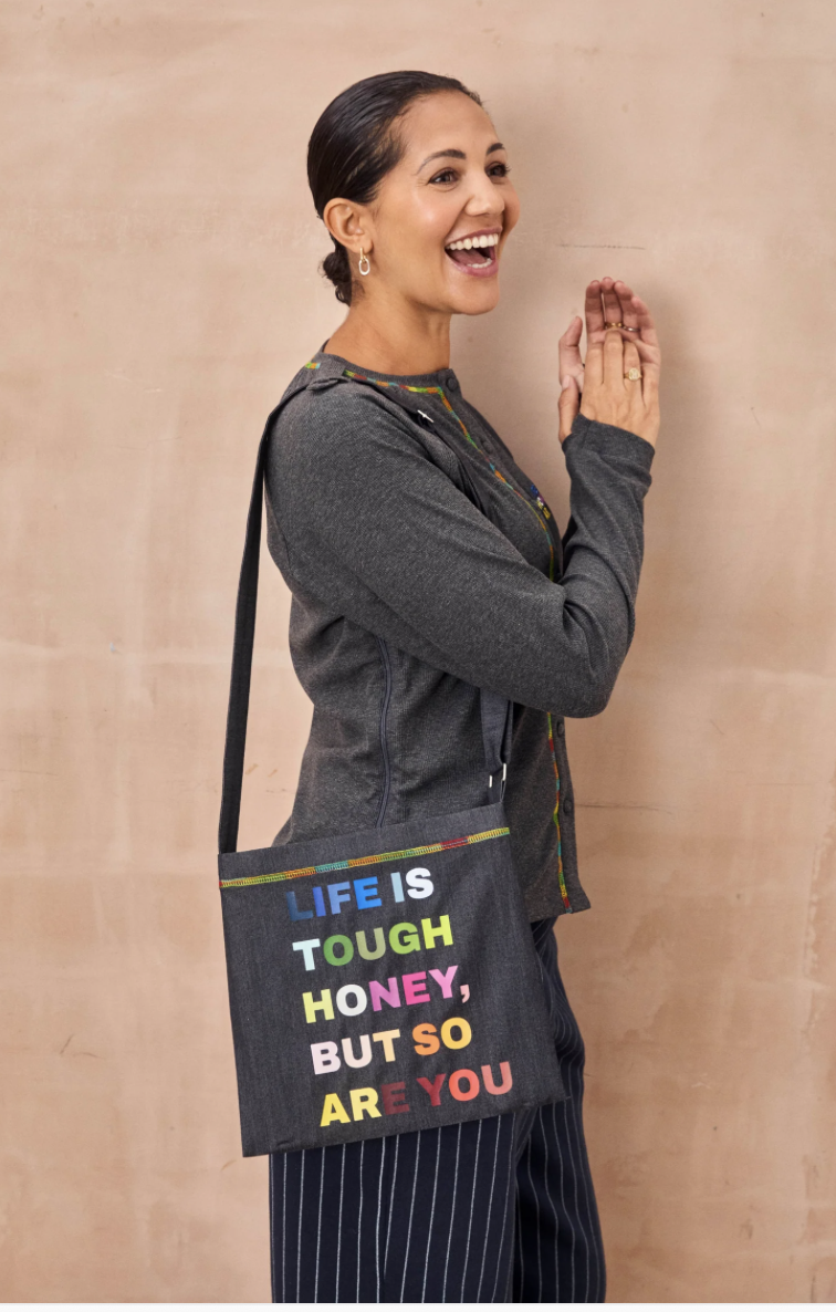 The Life Is Tough Drainage Bag with rainbow coloured letters spelling out Life is tough honey but so are you.